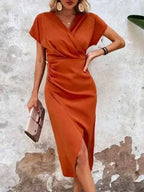 Oranje midi jurk met v-hals – Ruby